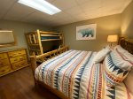 Lower level bedroom with a king size bed and bunk beds Twin 